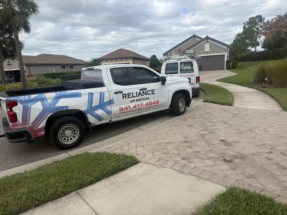 Reliance Air Services truck parked at a customer home