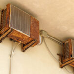 Old rusty air conditioner requiring repair