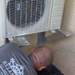 HVAC Technician Checking AC System for Damage