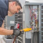 technician repairing an HVAC system Bradenton, FL