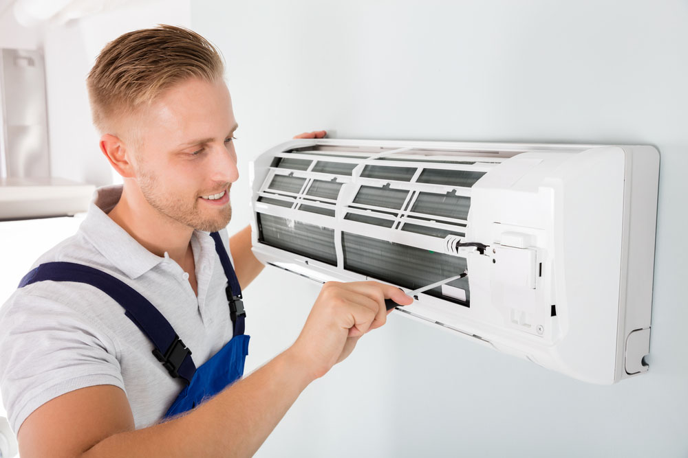 AC technician working on AC